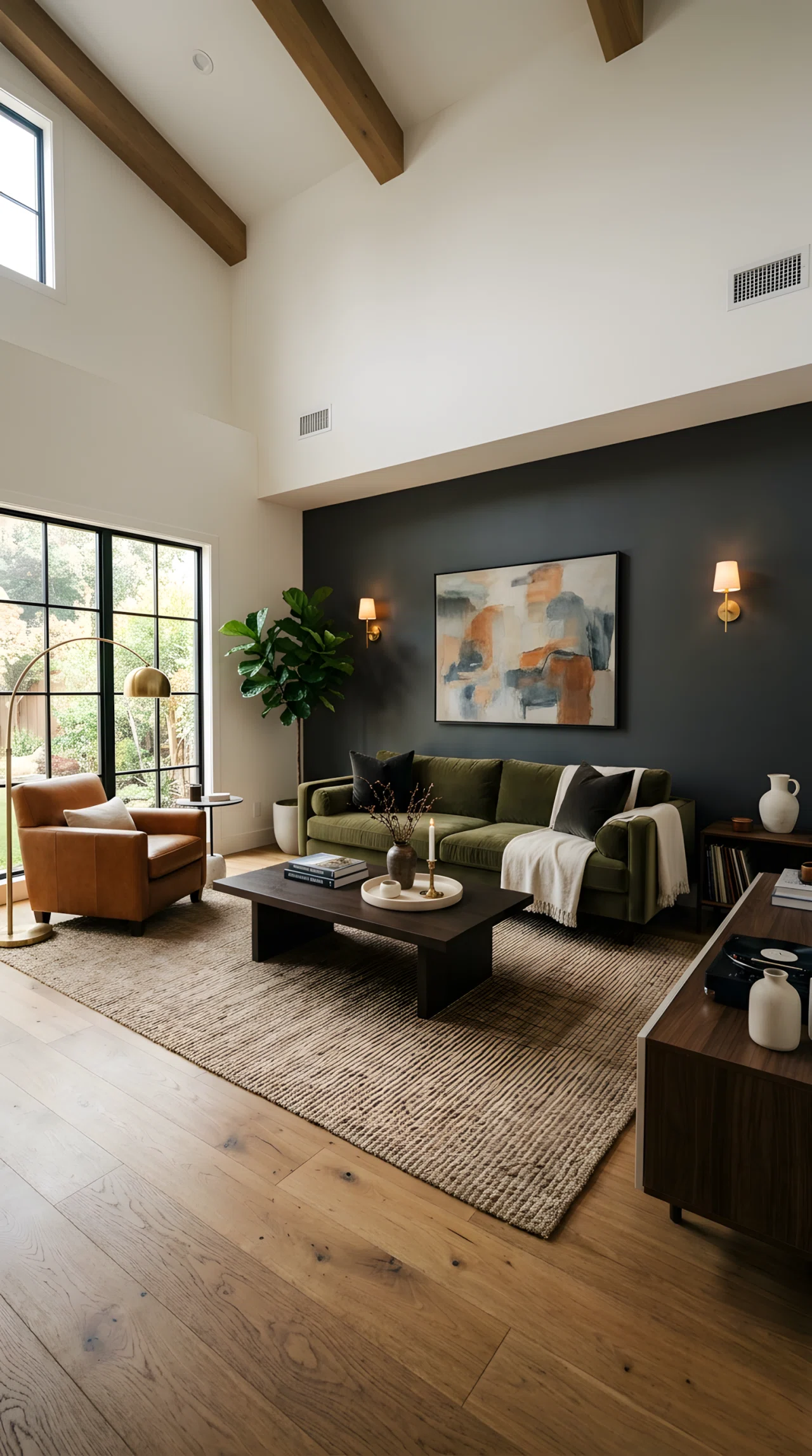 Wide dramatic angle photograph of a full living room, charcoal accent wall (RGB 54, 56, 58), deep olive velvet sofa (RGB 79, 89, 61), espresso wood coffee table (RGB 61, 45, 36), minimal accessories, warm ambient light, vibrant true-to-life stock photography, no 3D render.